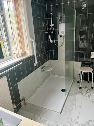 Walk-in shower with grab rails